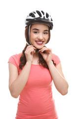 Beautiful young bicycle rider with helmet on white background