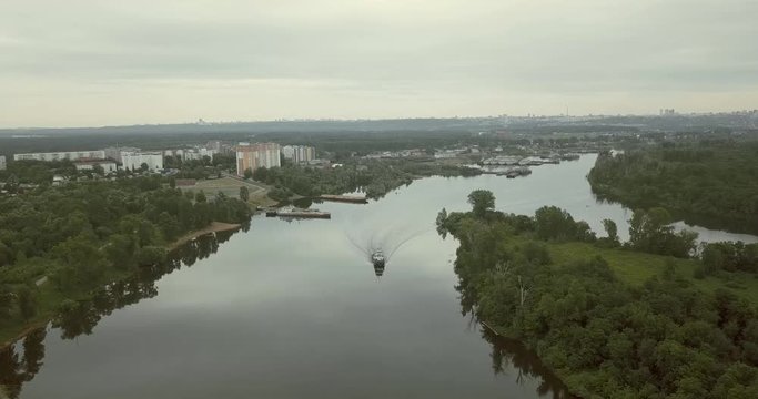 The barge floats along the river