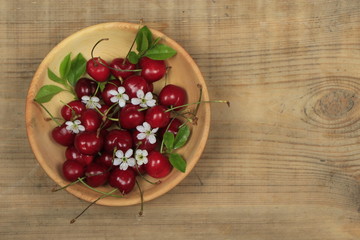 Fresh garden cherry in wooden table