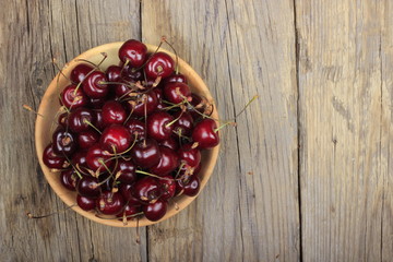Fresh garden cherry in wooden table