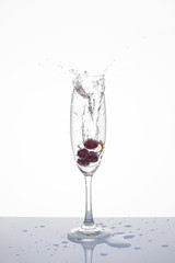 Grapes in a glass isolated, Soda splashes in the glass isolated.