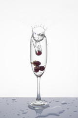 Grapes in a glass isolated, Soda splashes in the glass isolated.