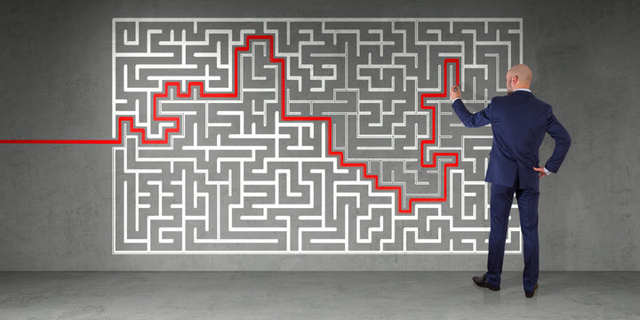 Businessman searching maze solution on a wall 3D rendering