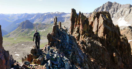 Man hiking to the summit on a 14er mountain in Colorado