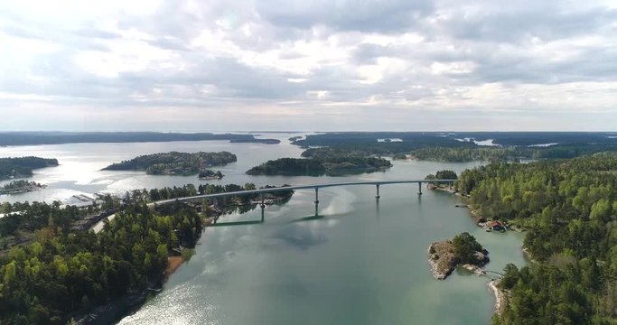 Lovon silta, Cinema 4k aerial rising view away from the lovo bridge connecting kemionsaari and kasnas, in the finnish archipelago, in Varsinais-suomi, Finland