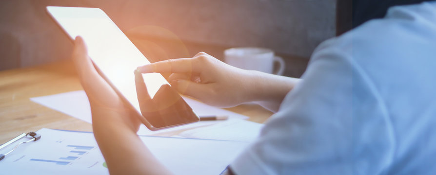 Businessman touching screen of modern tablet, closeup