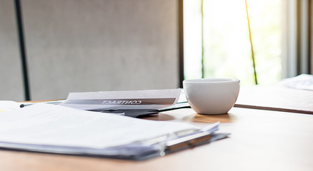 On the desk in office and hot coffee in morning