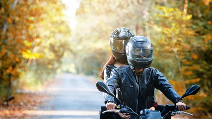 Foto op Plexiglas couple biker riding motorcycle © pixfly