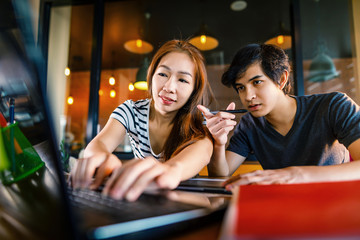 asian couple working at home