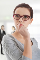 Portrait of thoughtful woman in eyeglasses.