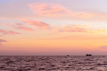 Naklejka premium a boat in the sunset