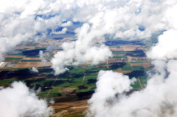 aerial view of the green field and white cloud