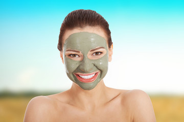 Beautifu toplessl woman with facial mask.