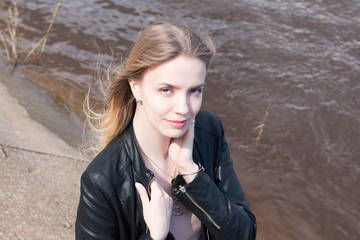 Portrait girl with blond hair and water