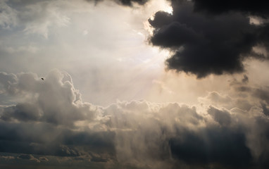 Naklejka na ściany i meble rays of Sun through the clouds