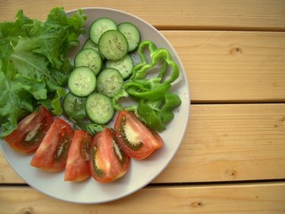 Sliced tomatoes, cucumber, green paprika and lettuce........