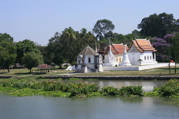 Fototapeta na wymiar small white Temple by the river in small province, Thailand. a peaceful good environment for meditation.