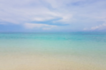 Abstract bokeh background from summer blue sea water at the beach.
