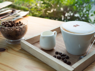 Hot coffee on wood table in coffee cafe
