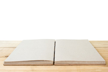 Open hand made book on table isolated on white background. Clipping path.
