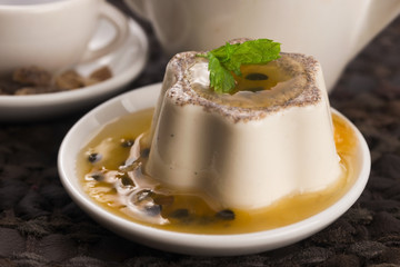 Panna cotta dessert with passion fruit and mint