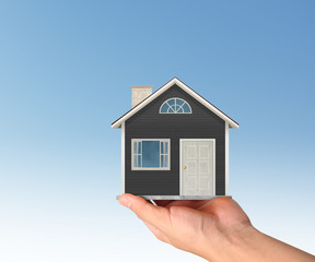 Mortgage concept by house from in hand