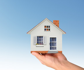 Mortgage concept by house from in hand
