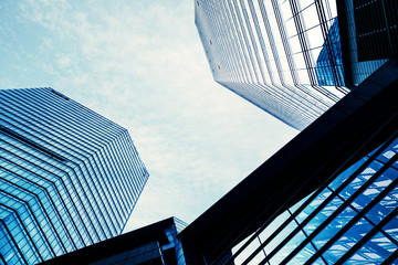 Look up at the modern city skyscrapers.