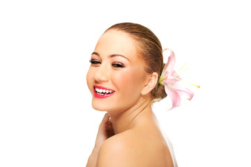 Beautiful laughing spa woman with lily.