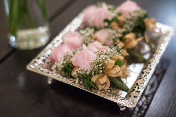 Beautiful Bow with Flower brooch design for parent of bride and groom in thai wedding ceremony. select focus blurred background