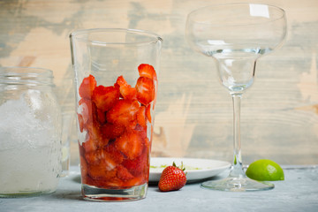 Making cocktail with strawberry. Selective focus.