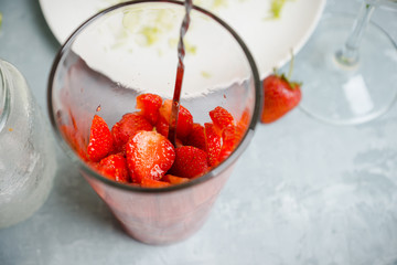 Making cocktail with strawberry. Selective focus.