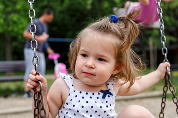 little girl at playgraund.