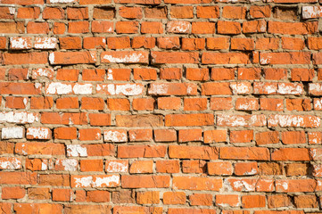 Photo of old red bricks wall. Damaged brick wall. Brick background