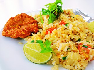 Thai Food Fried rice with lemon sliced and vegetables.