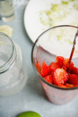Making cocktail with strawberry. Selective focus.