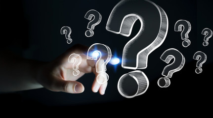 Businesswoman touching hand drawn question marks