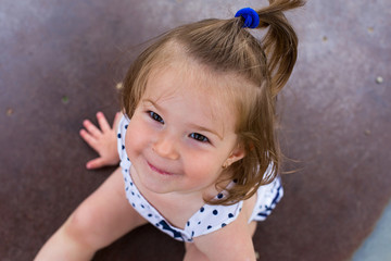 adorable girl playing at playground.