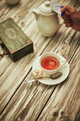 Bride and groom coffee break dating gift, bouquet on table.