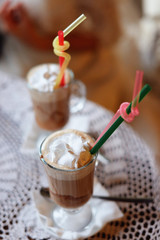 Bride and groom coffee break dating gift, bouquet on table.