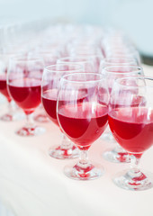 catering services. glasses with wine in row background at restaurant party