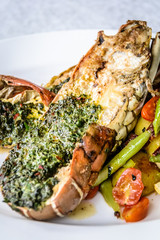 grilled lobster with herb crust and asparagus and lemon