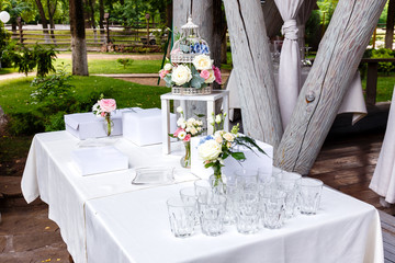 Wedding ceremony decorations in restaurant outdoors.
