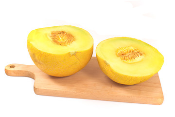 Cantaloupe melon on cutting board isolated on white