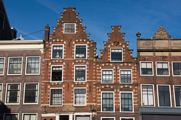 Fototapeta na wymiar Historic Dutch houses in the center of Haarlem in sunny spring day