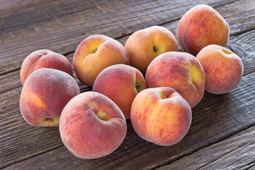 Peaches on wooden background