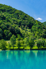Fototapeta na wymiar Turquoise water in Most na Soci lake in Slovenia