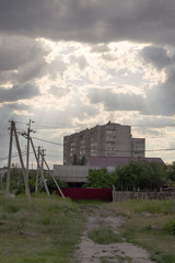 a house in the sun rays through the clouds