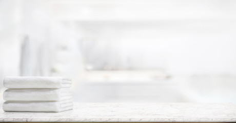  panorama shot : Towels on marble top table with copy space on blurred bathroom background. For...
