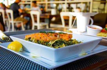 Baked salmon fillet with pasta and lemon